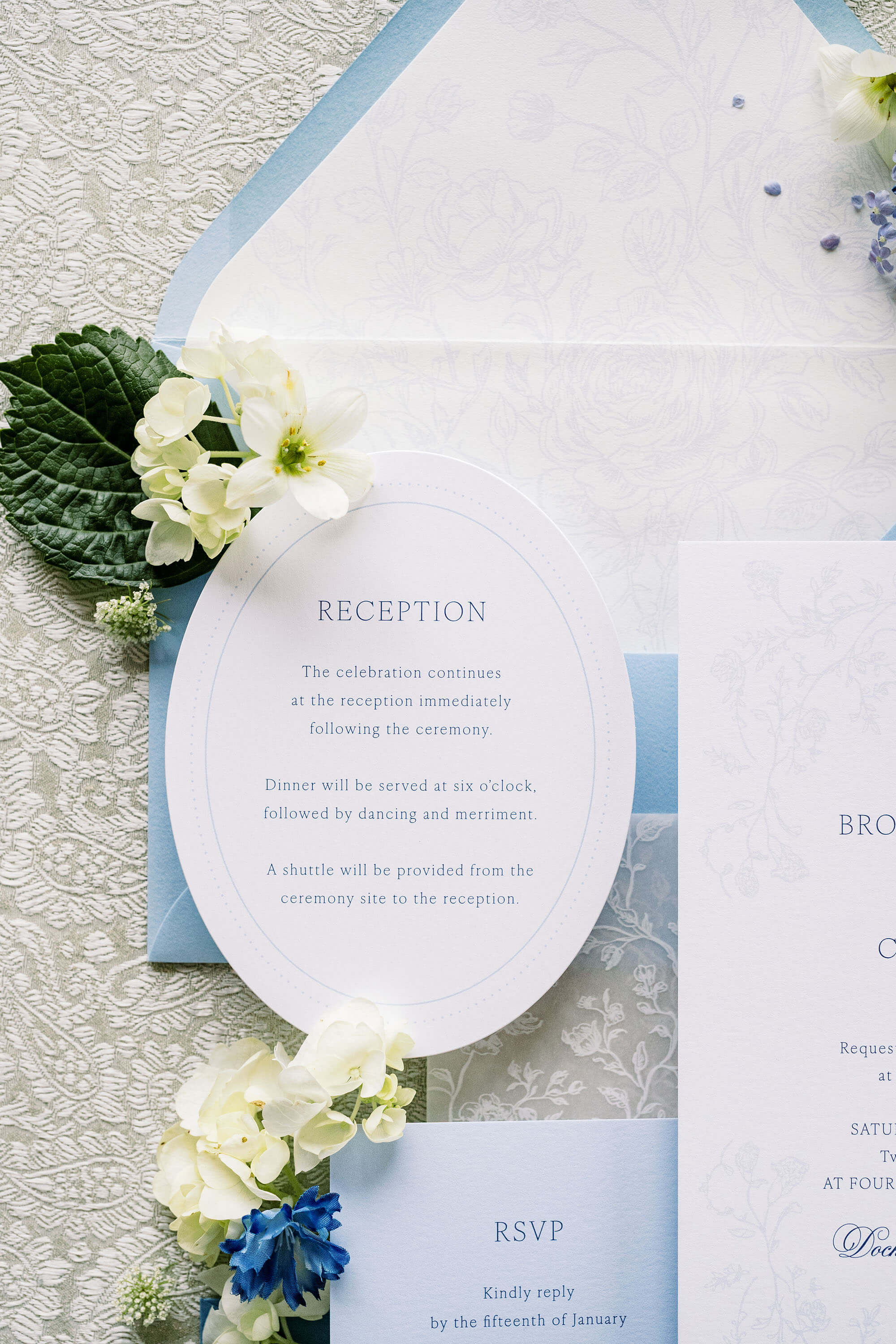 Blue floral wedding invitation liner and wedding enclosure card