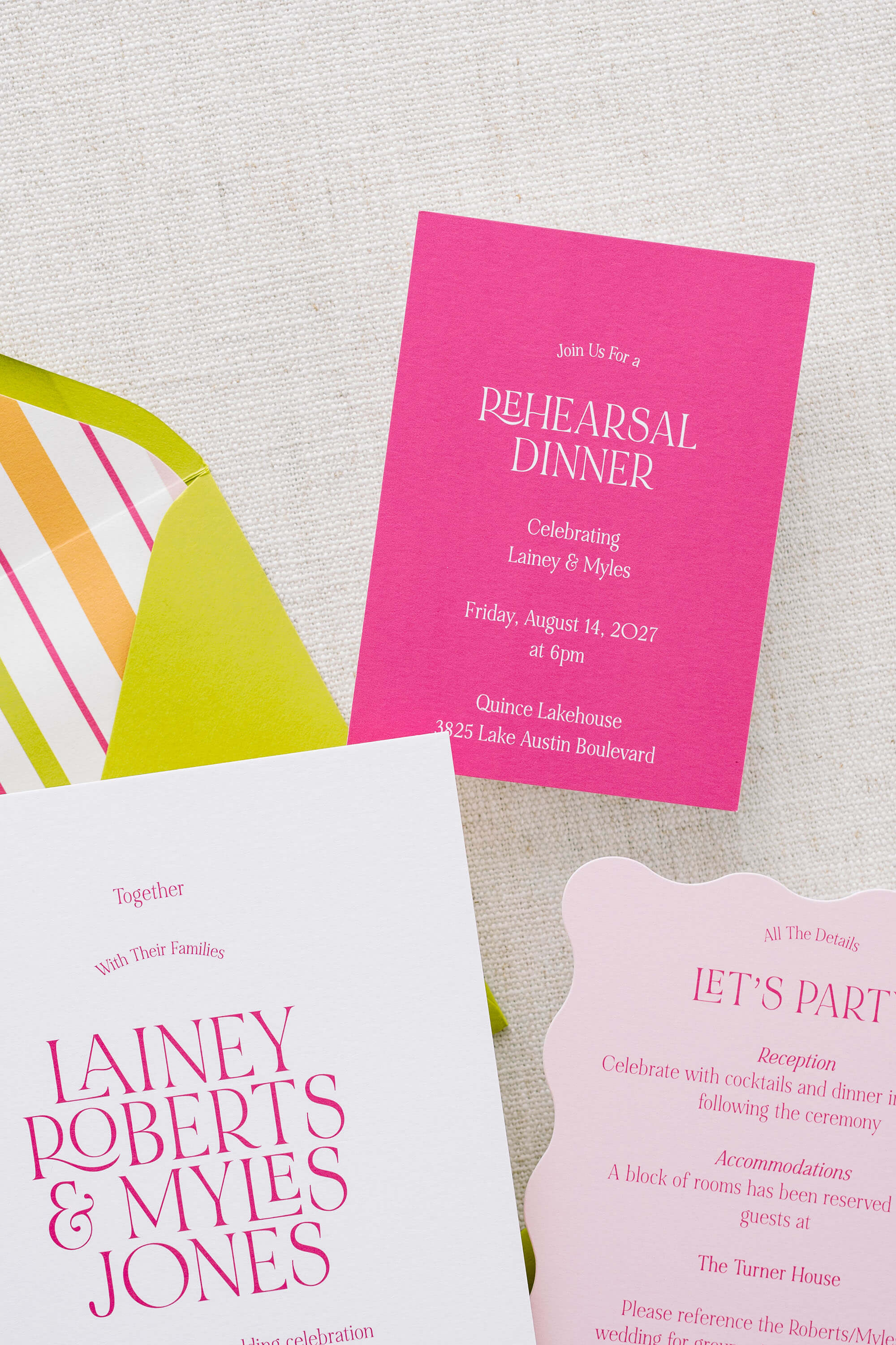 Set of invitations for a rehearsal dinner on a textured surface