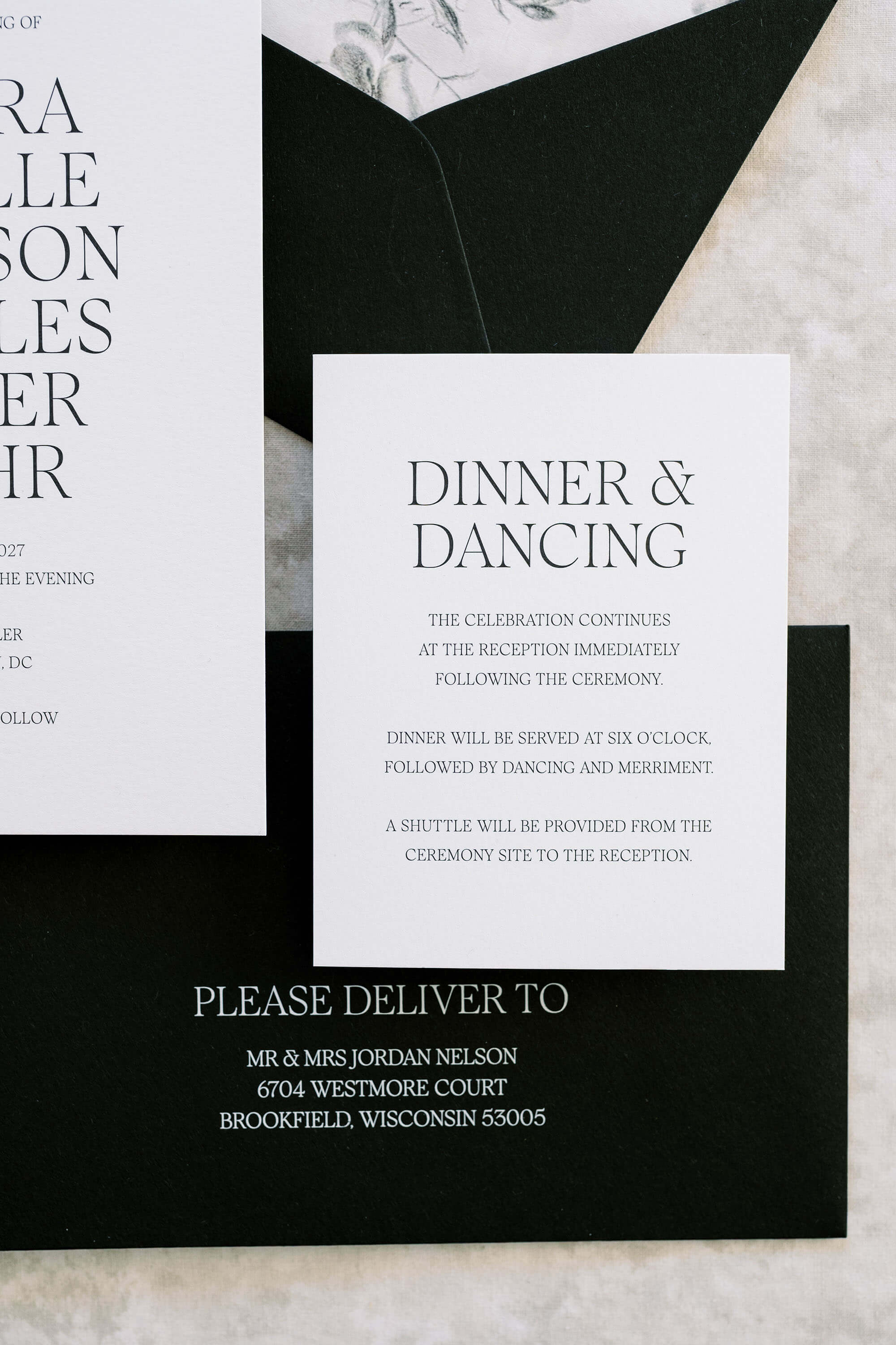 Wedding invitation card with text on a textured surface