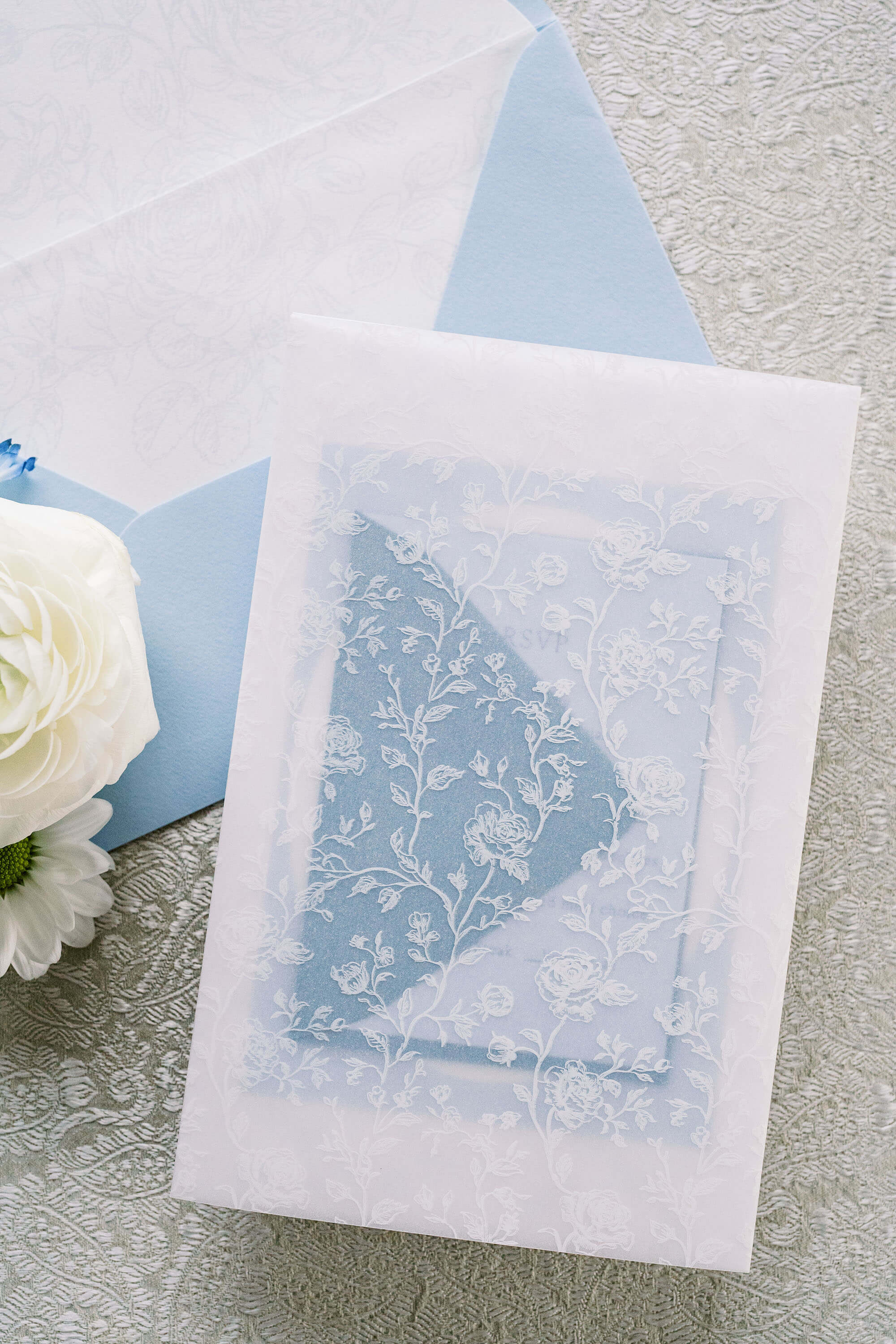 Blue wedding invitation with vellum wrap