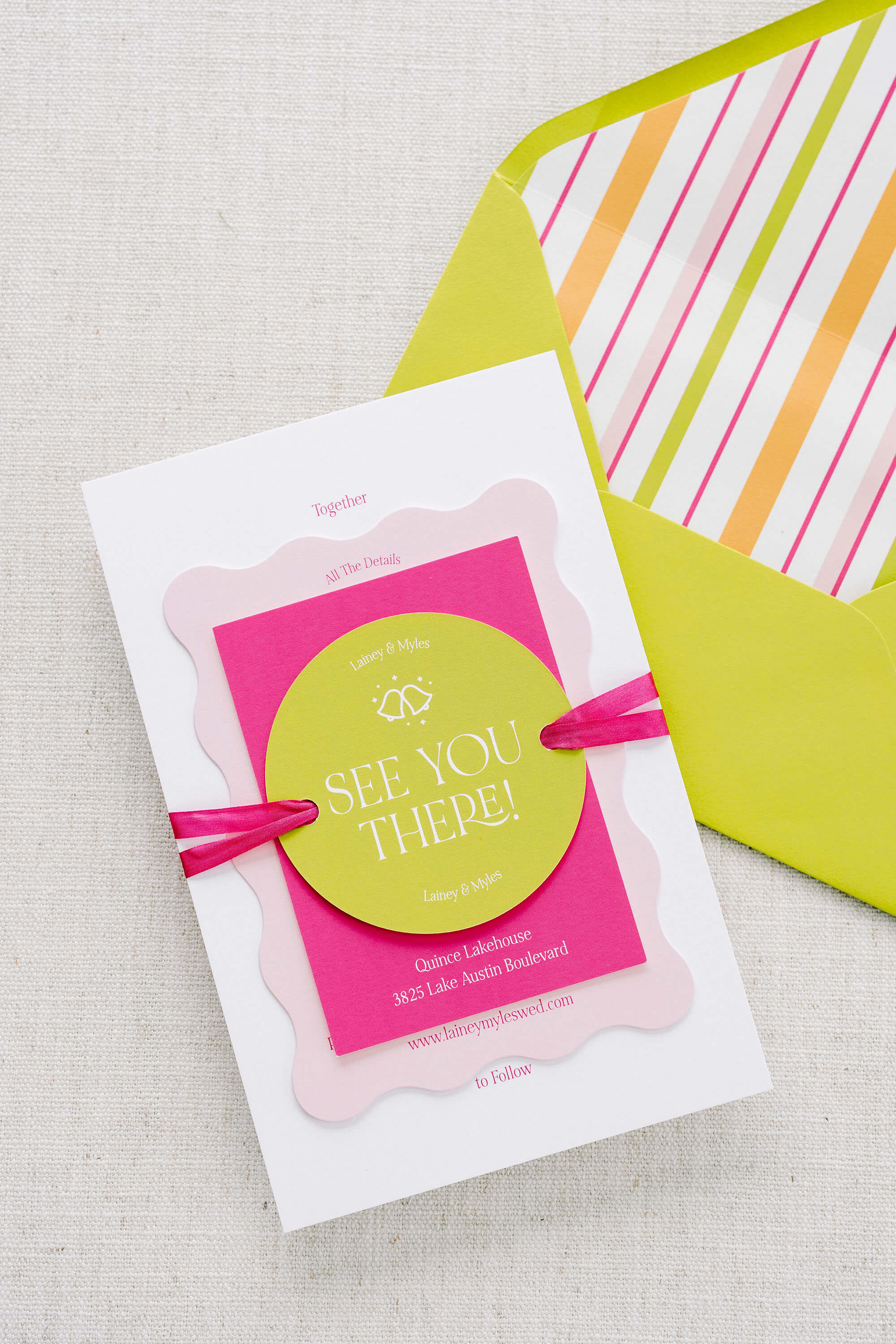 Funky wedding invitation set with green envelope and ribbon trim