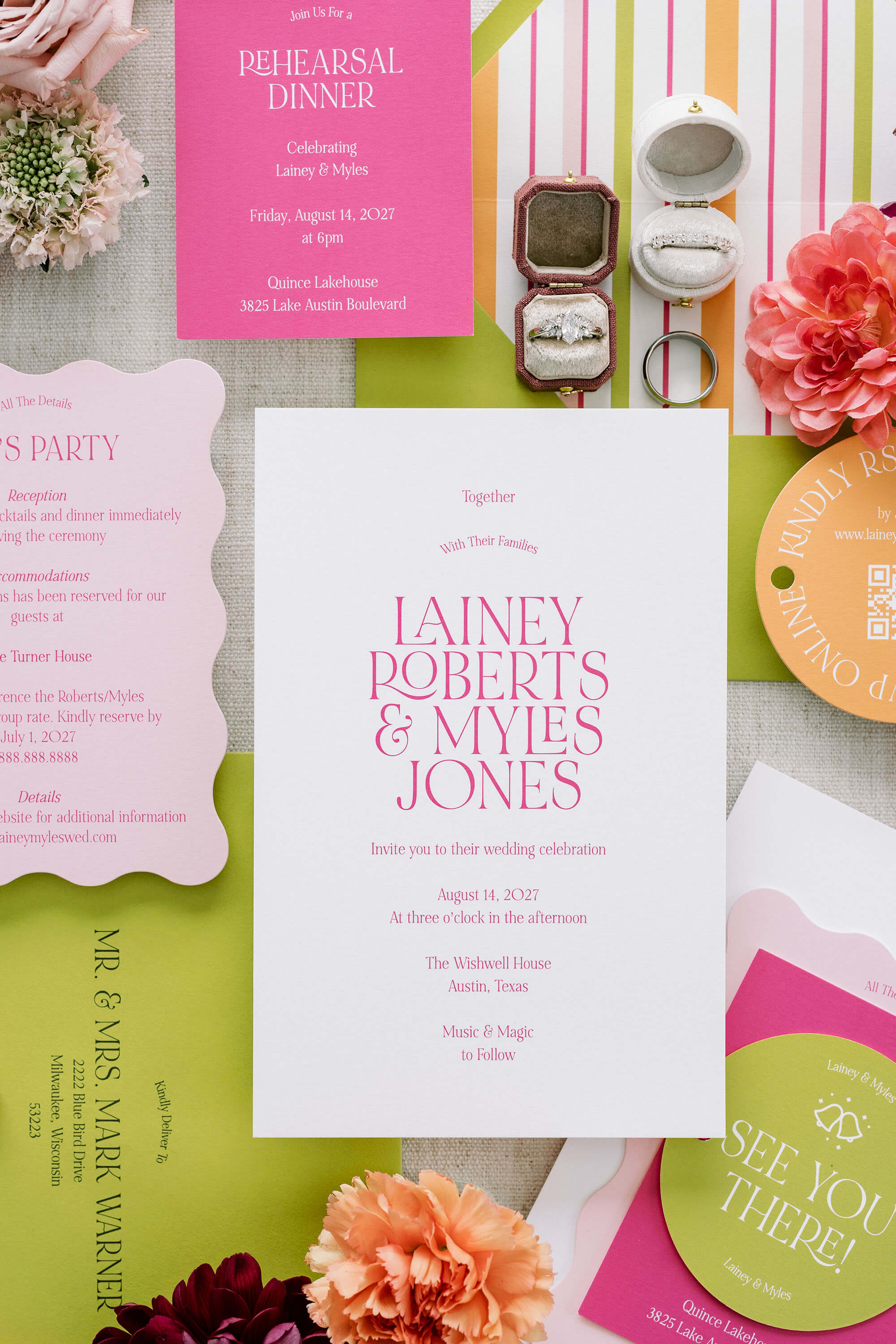 Colorful Wedding invitations with pink and green colors on a textured surface with flowers