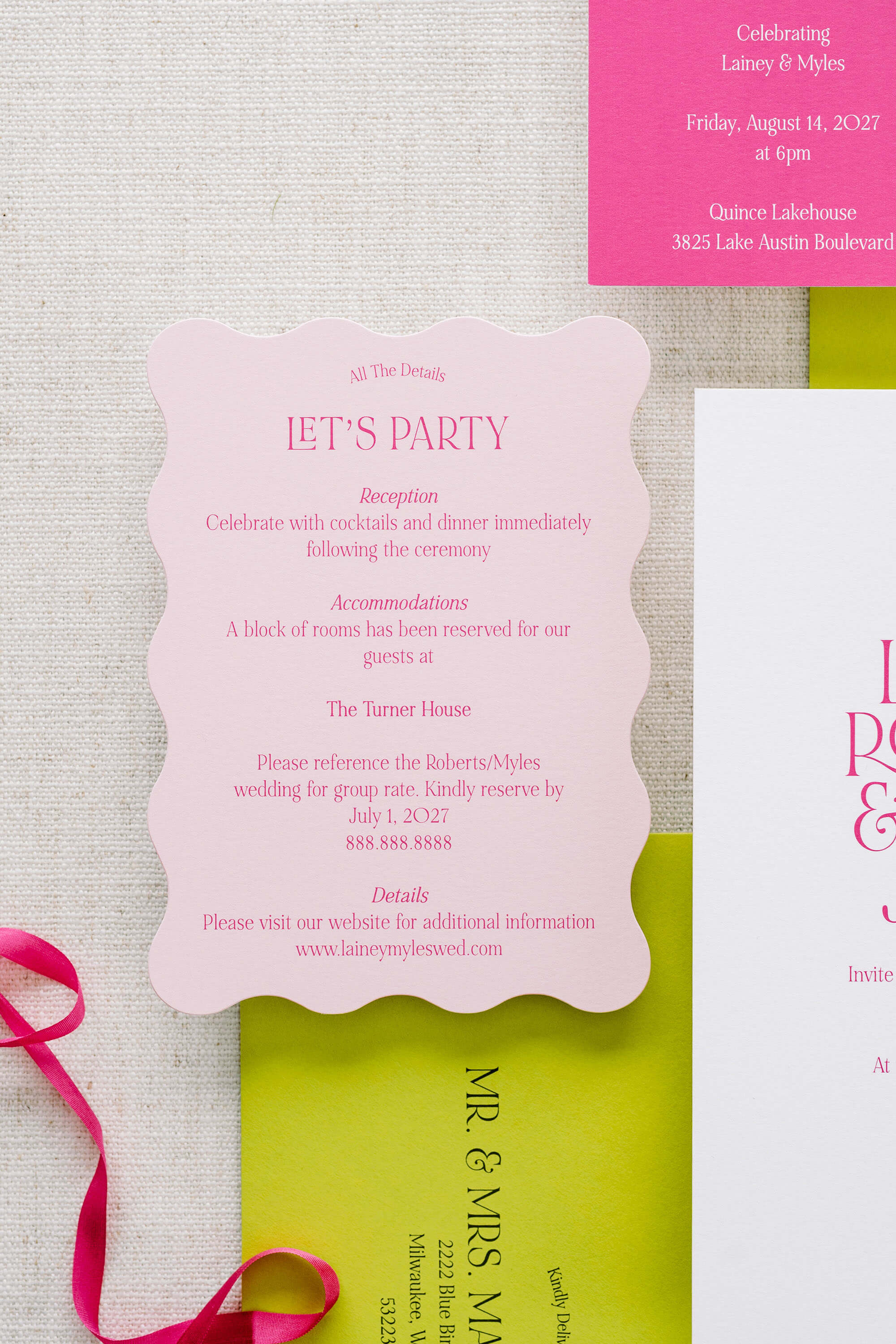 Wavy wedding invitation card with text on a textured surface