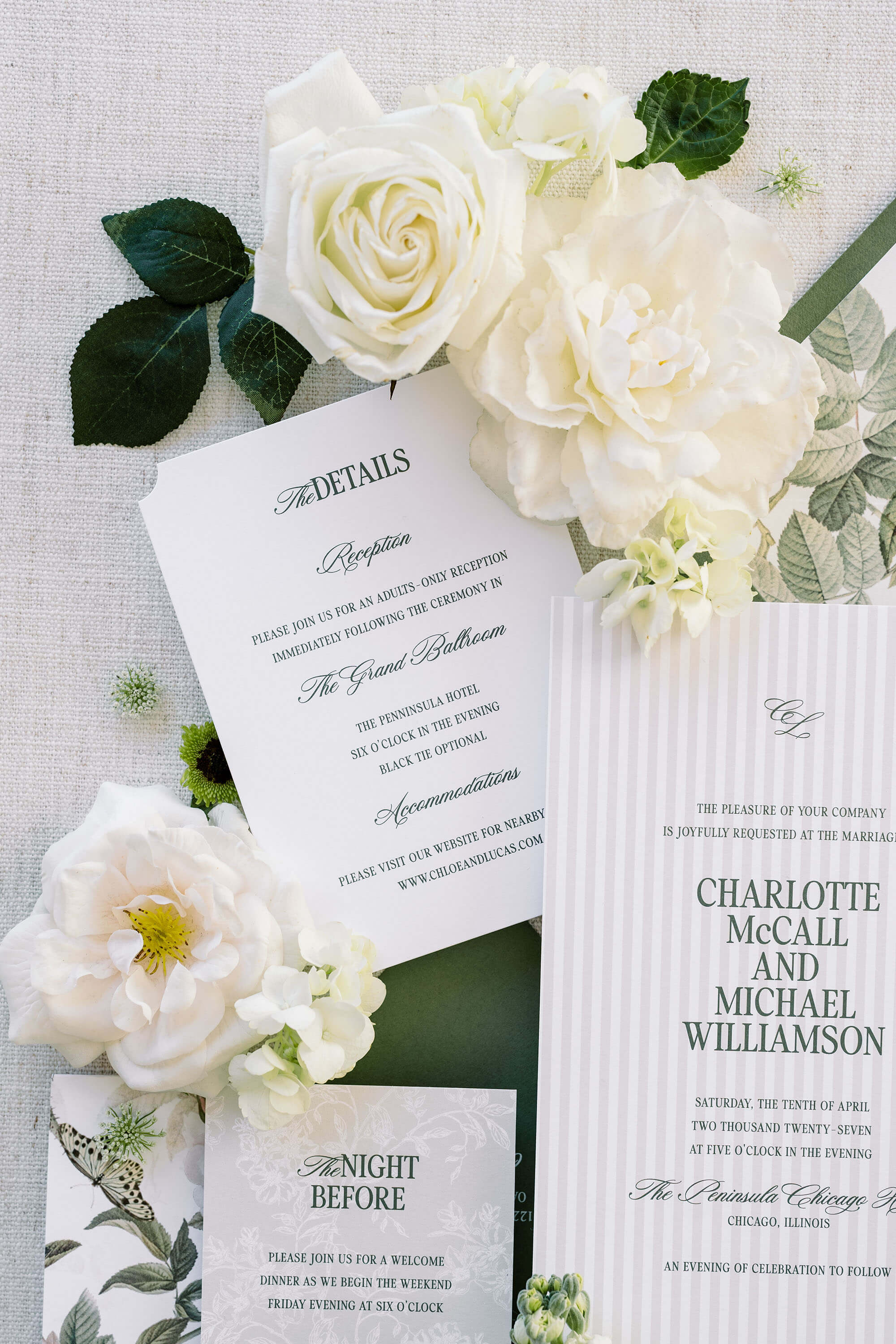 Old Money Wedding invitation set detail card with white flowers on a textured surface