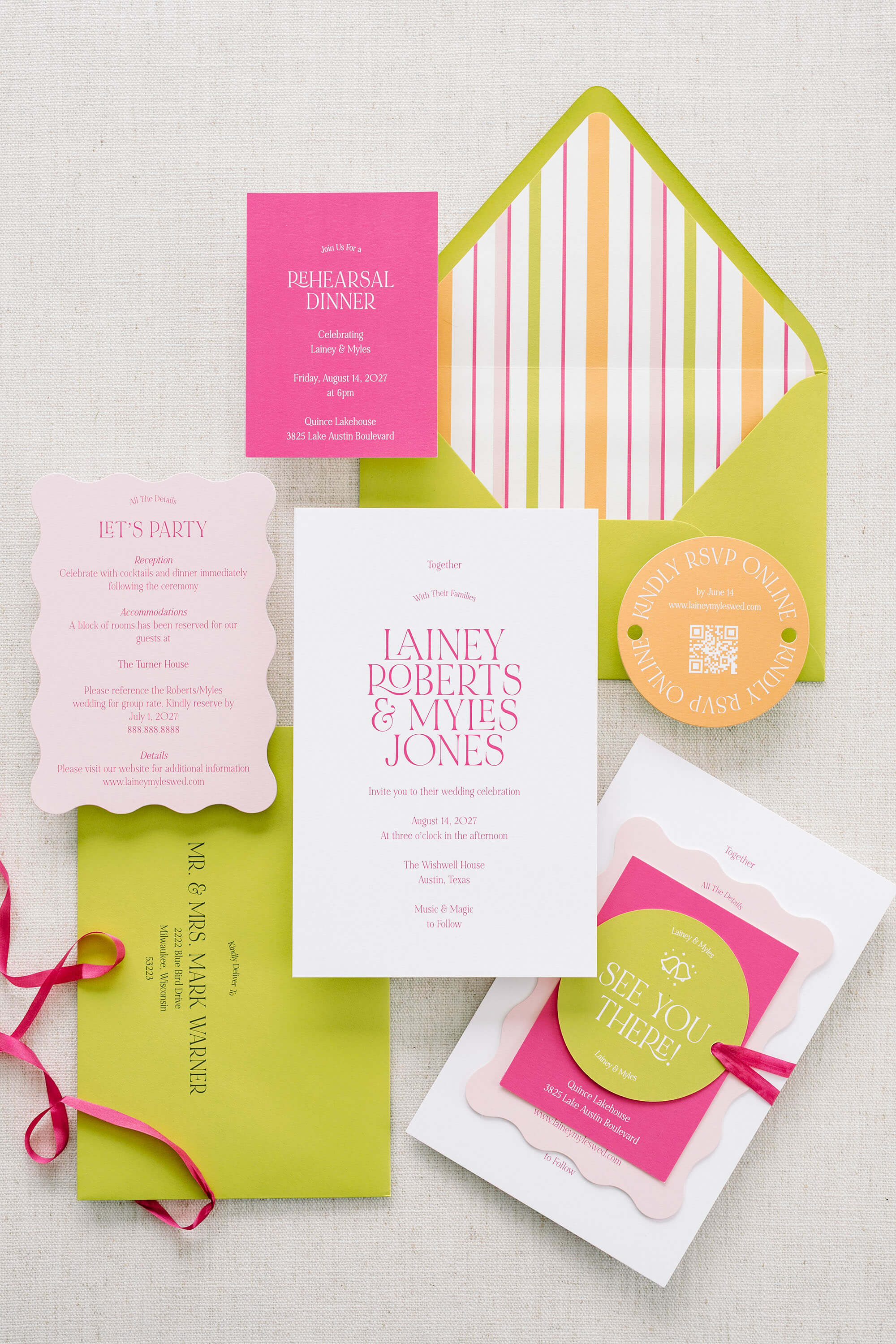 Colorful wedding invitation set sample kit with pink, green, and white elements on a light background.