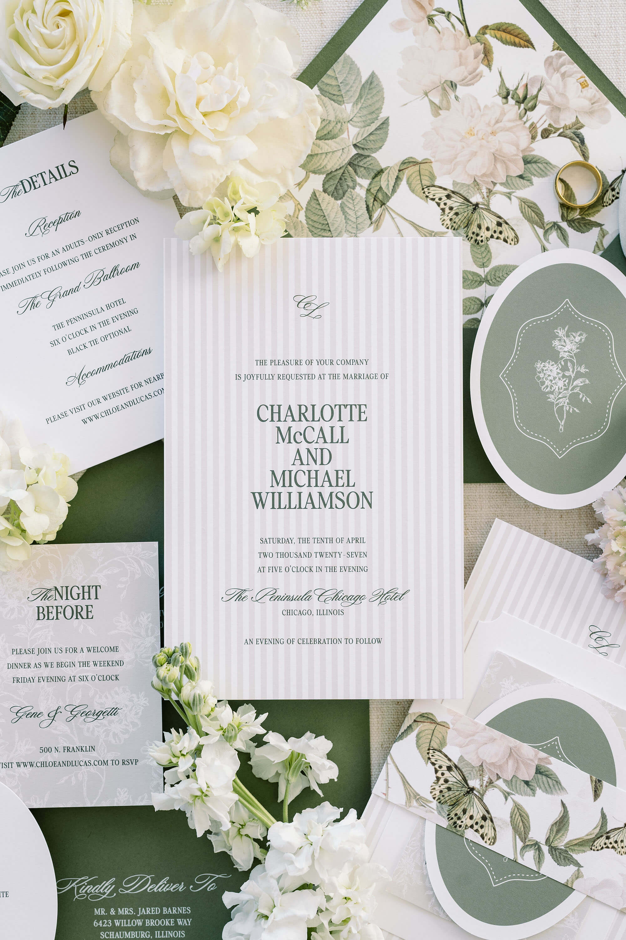 Wedding invitation card sample kit with floral decorations on a white background